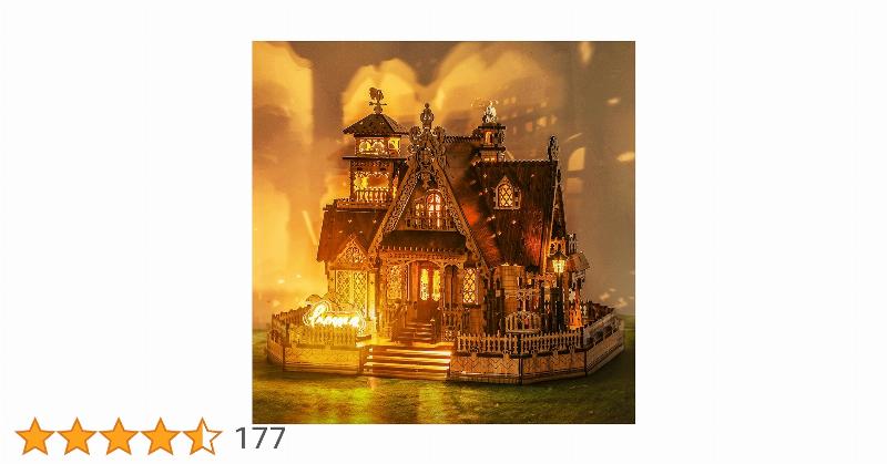 Une personne assemble minutieusement les pièces d'un Puzz 3D Notre Dame de Paris avec un plan de construction détaillé